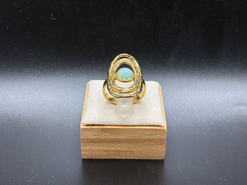 Bague dorée pierre ovale bleu-vert – Design ajouré