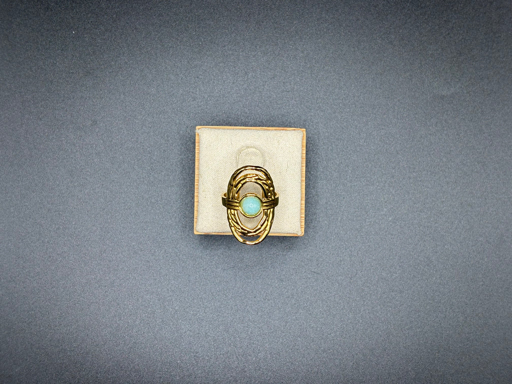 Bague dorée pierre ovale bleu-vert – Design ajouré
