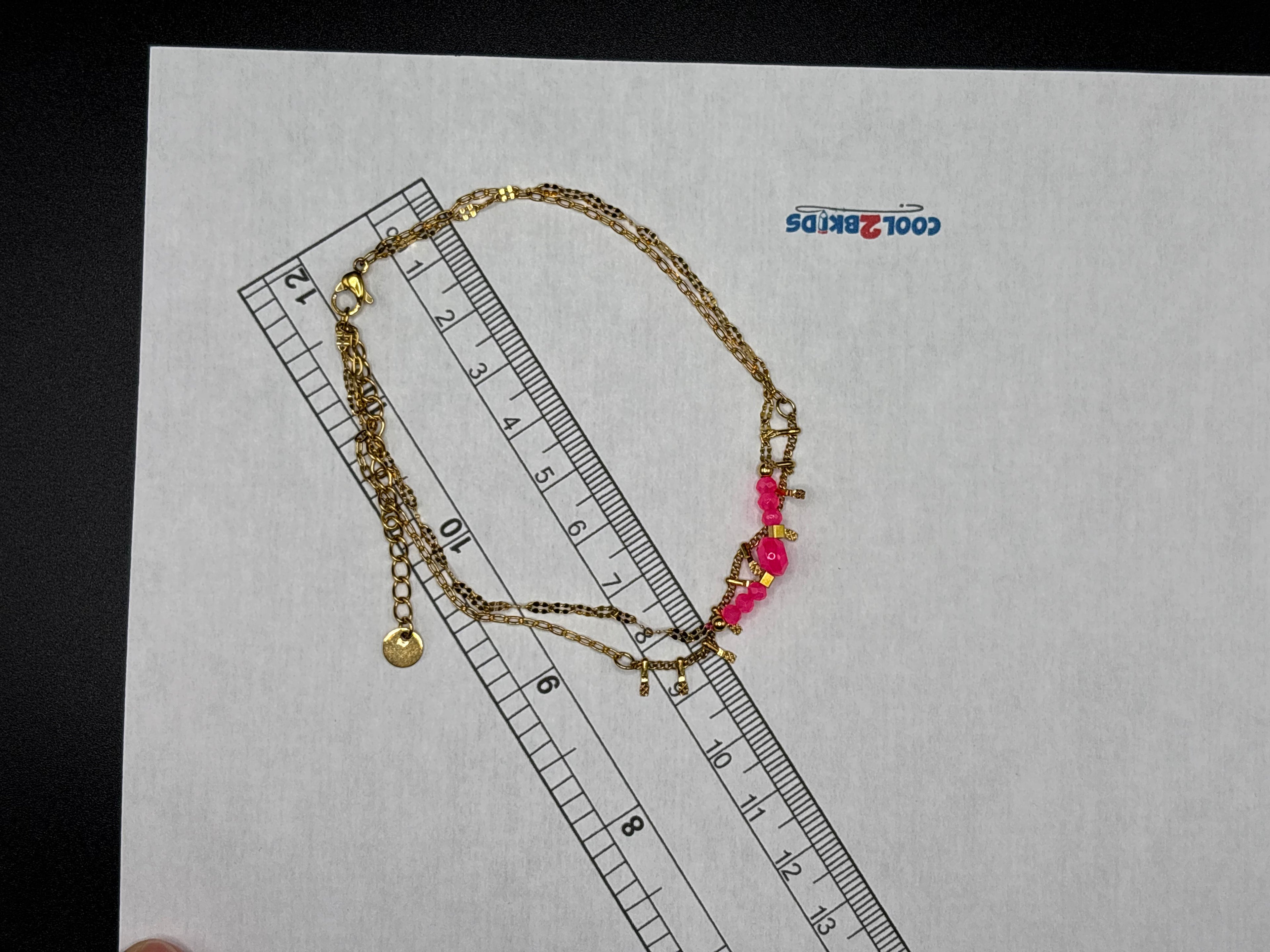 Bracelet de cheville double chaînes dorées avec perles roses