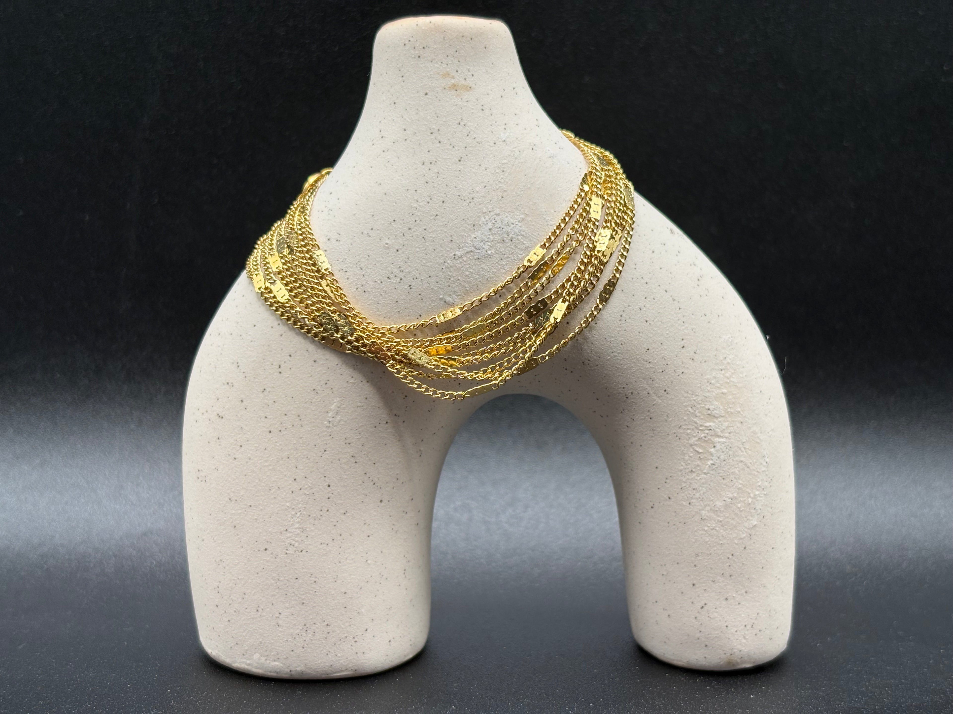 Bracelet multi-chaînes doré à barres verticales